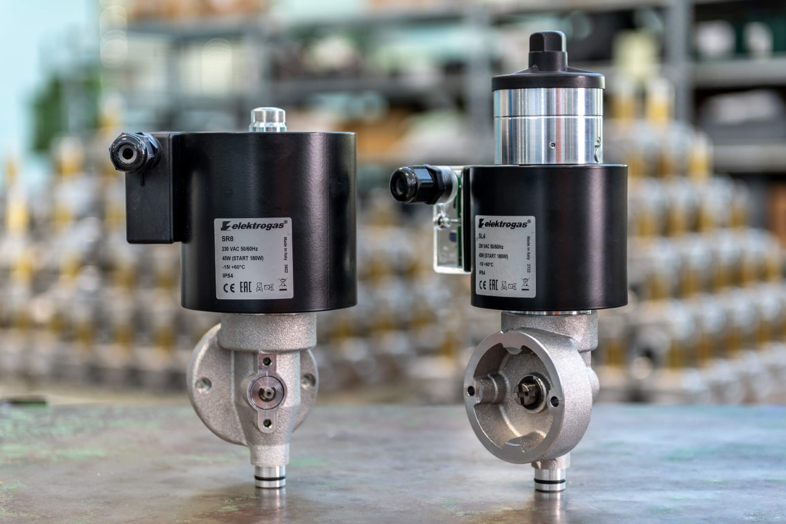 Elektrogas Automatic solenoid actuators for control valves fast/slow opening fast/slow closing. Solenoid actuators operate VF, VFR and VFH butterfly valves. When the coil is unenergized, the inner spring pushes down the plunger and uses gear mating to shift the connected valve to the minimum opening position. When energized, the coil moves the plunger up quickly (SR) or slowly (SL-ST), shifting the valve to the maximum opening position. This device, connected to VF, VFR and VFH butterfly valves, is used in two-stage control of gas and air in combustion processes.