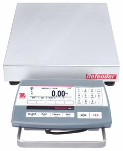OHAUS Industrial Bench Scale: 12 in x 12 in, Not IP Rated, Front-Mounted, Defender 5000 (MPN 30461648). Key specifications — Connection Ports: RS-232; Readability: 0.001 lb/0.5 g; Brand: OHAUS; Weighing Surface Material: Stainless Steel.