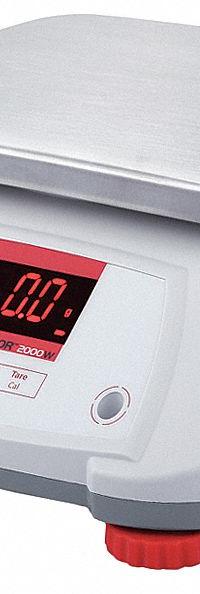 OHAUS Food Scale: 7 1/2 in Weighing Surface Dp, 9 1/2 in Weighing Surface Wd, 4 7/8 in Overall Ht (MPN V22PWE6T). Key specifications — Readability: 0.002 lb/1 g; Brand: OHAUS; IP Rating: IPX8.