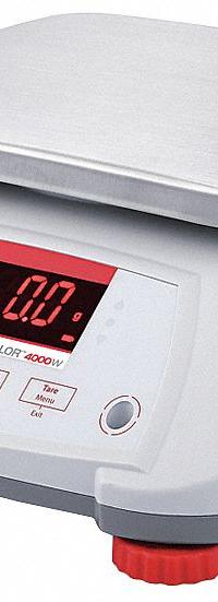 OHAUS Food Scale: 7 1/2 in Weighing Surface Dp, 9 1/2 in Weighing Surface Wd, 4 7/8 in Overall Ht (MPN V41PWE6T). Key specifications — Readability: 0.002 lb/1 g; Brand: OHAUS; IP Rating: IPX8.